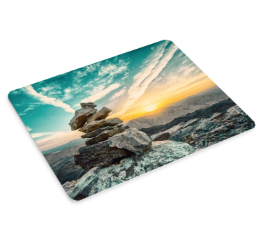 Mousepad weltkarte mit sonnenuntergang über steinhaufen - TenStickers