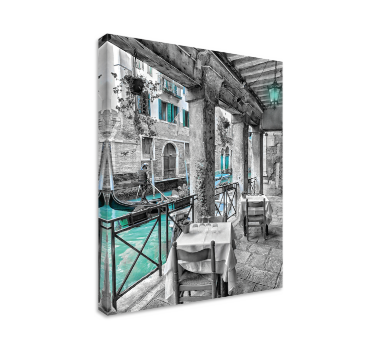 Leinwandbild Mann, der auf boot neben restaurant venedig reitet - TenStickers